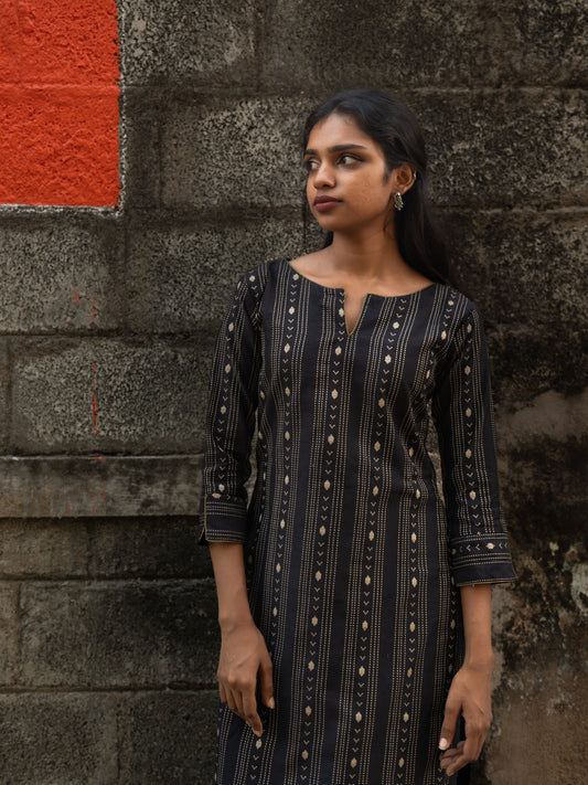 Front view of black cotton silk kurti with gold stripes, round split neck, and gold piping detail from Sakyaa