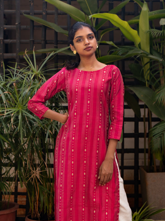 Front view of bright pink silk cotton kurti with gold woven stripes and boat neckline from Sakyaa.